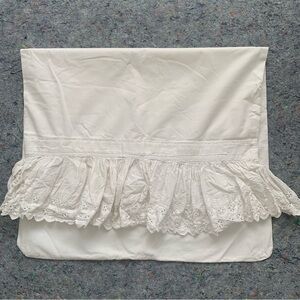 Adorable antique white cotton bed pillowcase with an ornate embroidered ruffle